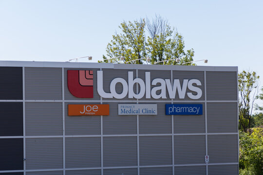 Ottawa, Canada - July 30, 2026: Loblaws supermarket sign on building with pharmacy and clinic signs