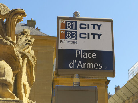 METZ, FRANCE - AUGUST 13, 2026 - Bus stop sign displaying route numbers and destination in Metz, France