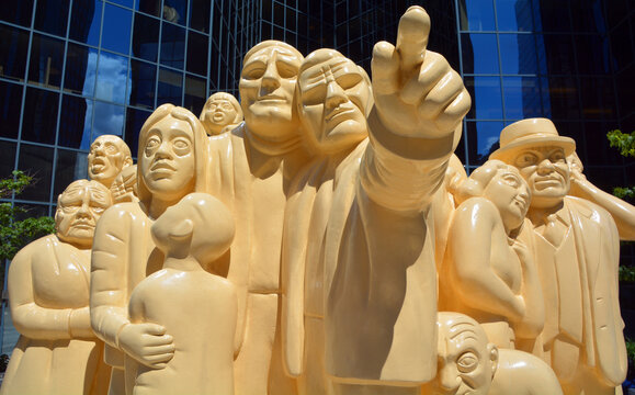 MONTREAL QUEBEC CANADA: The "Illuminated Crowd" is a public sculpture, made in 1985 by artist Raymond Mason from stratified polyester resin with polyurethane paint.