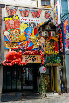 Iconic storefront of Takoya Dotonbori Kukuru with its unmistakable 3D octopus signage. Founded in 1985, the famous takoyaki restaurant operates about 60 locations nationwide.