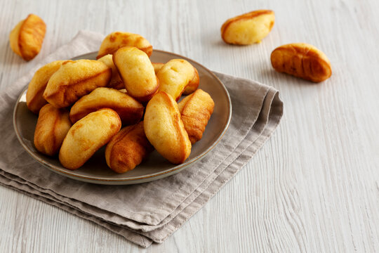 Homemade Sweet French Mini Madeleines on a Plate, side view.