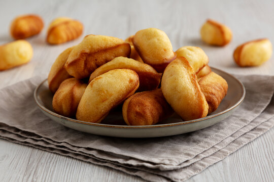 Homemade Sweet French Mini Madeleines on a Plate, side view.