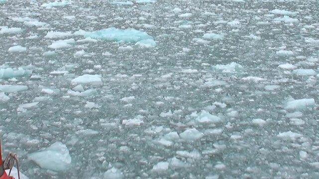 A ship's perspective glides over the immense, tranquil Arctic Ocean.