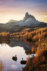Fototapeta premium Stunning autumn sunrise reflection at Lago di Limides in Italy 2024