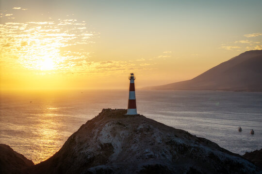 Scenic sunset view of Punta Coles lighthouse in Peru 2025
