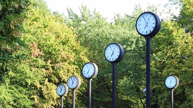 Many clocks or many analog clocks show parallel work and team coordination in global collaboration and international collaboration. Synchronous clocks for time keeping in project management projects.