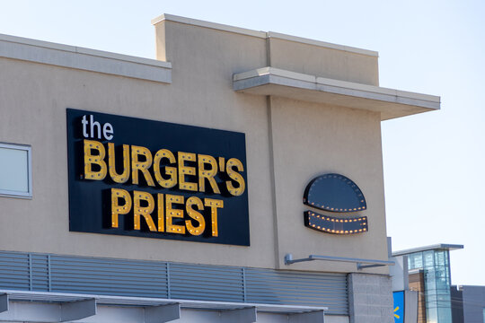 Ottawa, Canada - July 30, 2026: The Burger's Priest fast food restaurant sign and logo on building