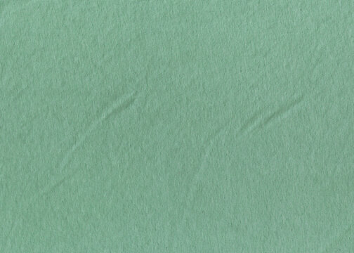 Green fabric canvas texture background. Soft velour texture for design.	