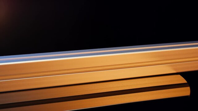 Colorful anodized aluminum profiles glowing against dark background
