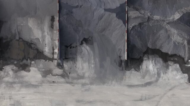 Industrial mining front loader moving gravel at quarry site