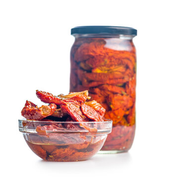 Sun-Dried Tomatoes in Olive Oil in a Glass Bowl Close-Up on White Background
