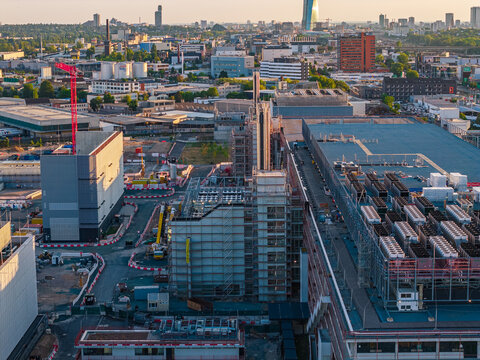 Frankfurt am Main, Germany - 02 August 2026: Aerial view of Digital Realty Frankfurt FRA18 data center construction site with cranes, scaffolding, and cooling units.