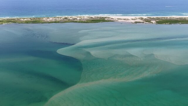 Currents from the North Atlantic Ocean continuously shape the sand banks and beaches of Cape Cod, Massachusetts. The entire peninsula is in constant movement due to its geologic makeup of mostly sand.