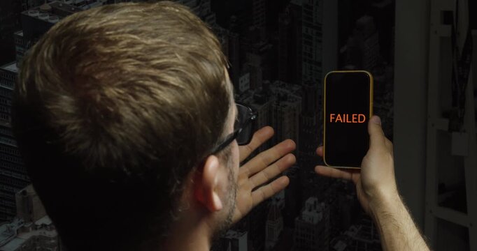 Man attempting Face ID authentication on a smartphone with a failed recognition message. Ideal for biometric security, identity verification, and mobile technology concepts.