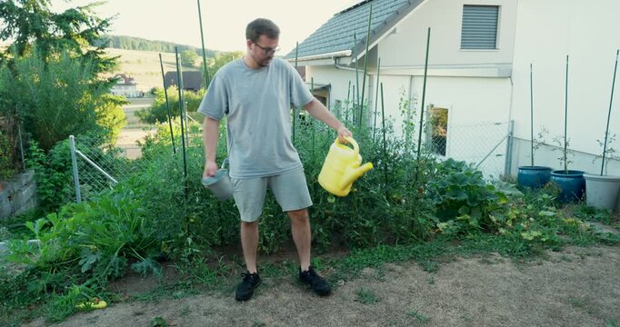 Man unable to water his vegetable garden because there is no water. Ideal for drought, water shortage, climate change and food production.