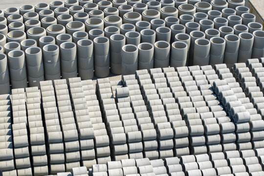 Tarnow, Poland - 31 July 2026: Aerial view of the Bruk-Bet production plant featuring rows of stacked concrete pipes and industrial materials in an outdoor storage yard.