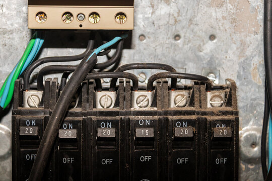 Electrical breaker panel with NEMA circuit breakers and wiring. Focus on home electrical systems and maintenance for stock.