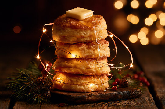 biscuit stack wrapped in glowing Christmas fairy lights