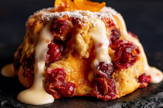 cranberry-orange biscuit drizzled with white chocolate glaze