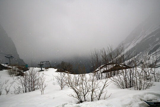 Russia. North Ossetia. Tsei Ski Complex. Upper Station 2870. View towards the bottom station. Snow fog