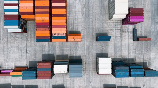 Cargo container terminal with moving truck aerial view