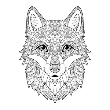 Intricate wolf portrait with complex zentangle patterns and ethnic mandala details, concept for stress relief and mindfulness, perfect for adult coloring book pages, tattoo designs, and creative