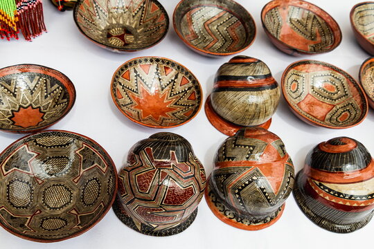Traditional handmade ceramic bowls and vessels known as mukawas or Canelos-Quichua pottery, crafted by indigenous Kichwa women in the Pastaza province of the Ecuadorian Amazon.