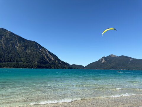 Kitesurfer Riding on Turquoise Walchensee in the Bavarian Alps, Germany