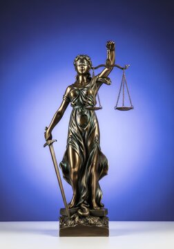 Majestic bronze sculpture symbolizing fairness and law with balanced scales and a sharp sword, representing the impartial judicial system, legal, litigation, crime