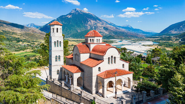 Aerial drone view of the Church of the Apostle Thomas and Saint John the Theologian,  overlooking the Vjosa River valley in Tepelene, Albania
