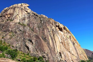 Fototapeta premium Sheer Granite Rock Face Rising Against Clear Blue Sky in Madagascar