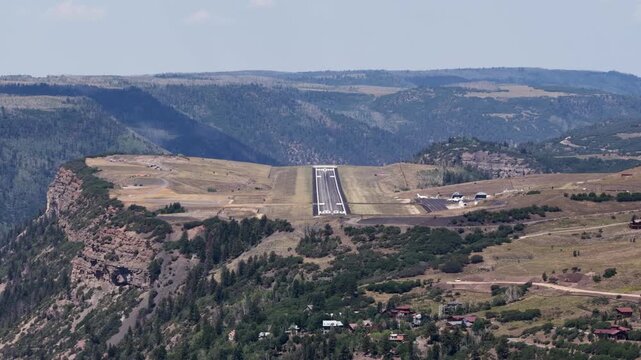 Aerial of Telluride Colorado small regional airport on mountain top mesa in summer