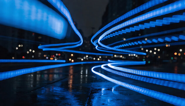 Blue light streaks create an abstract speed concept photograph at nighttime acceleration afterglow blur bright cityscape color communication contemporary curve darkness dynamic energy