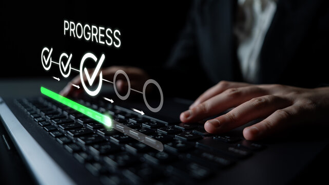 Digital Progress Bar Concept with Hands on Keyboard in a Dark Setting Representing Technology and Advancement in Work Process. Bitwise.