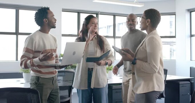 Diverse coworkers standing at office sharing laptop notes as newcomer approaching for brief update