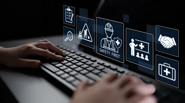 Hands Typing on a Computer Keyboard with Safety Icons Displayed in Background for Workplace Safety and Health Management Concepts. Bitwise.