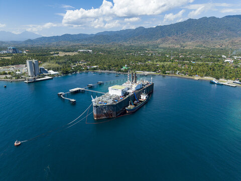 Aerial view of a Floating Storage and Offloading Ship moored at a pier in the coastal waters of Buleleng Regency, Bali, Indonesia.