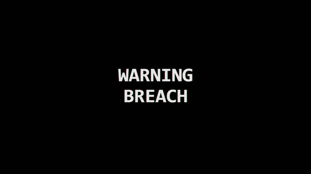 Warning breach text animation flashing on screen for digital security alert