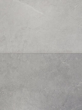 High-resolution texture featuring dual-toned grey stone and concrete tile surfaces divided by a clean horizontal seam line. Designed for interior design mockups, architectural background rendering