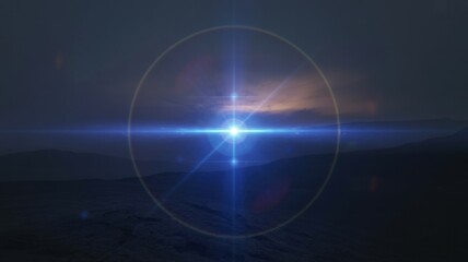 Obraz premium Blue lens flare light streak and sun halo effect in dark mountain sky