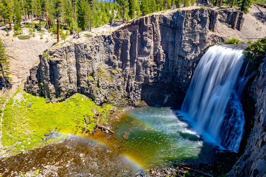 Rainbow Falls dropping over volcanic cliff into pool at Devils Postpile National Monument California
