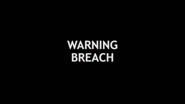 Warning breach digital text alert message on a dark computer screen interface