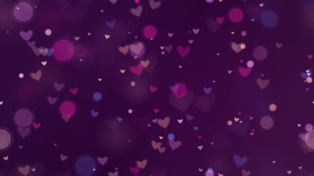 Dark purple background with floating glowing pink and purple hearts and bokeh. This seamless romantic motion graphic loop is perfect for elegant valentine and wedding video designs.