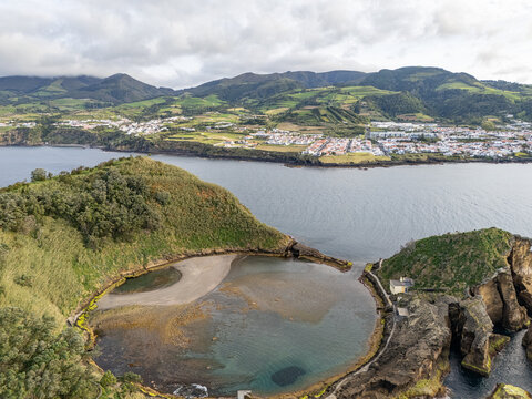 Aerial view of Ilheu de Vila Franca do Campo, a volcanic islet with a circular crater lagoon, surrounded by the Atlantic Ocean, Sao Pedro, Acores, Portugal.