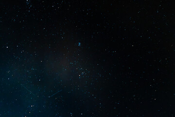 starry night sky withglowing blue stars and deep space background. © Yonit