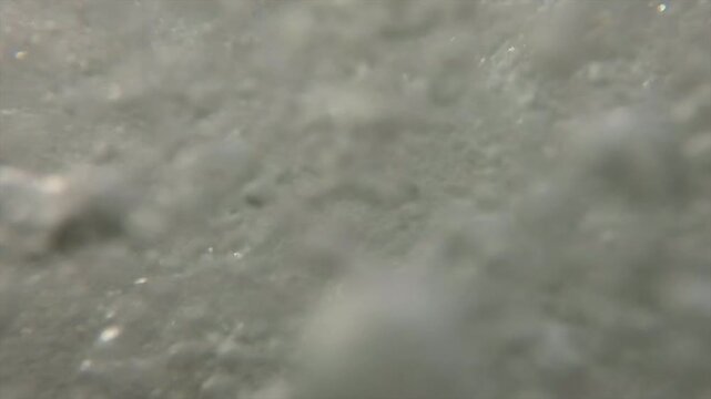 Abstract underwater bubbles rising in crystal clear liquid with dynamic motion and organic textures.