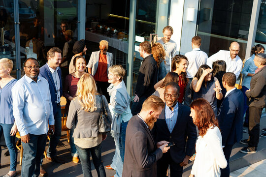 Diverse group socializing outdoors photo