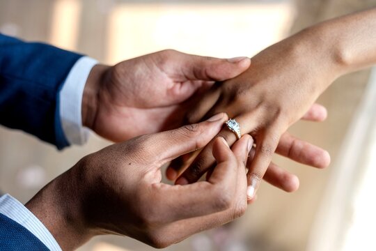 Romantic engagement ring exchange moment