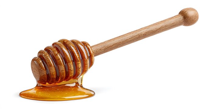 A wooden honey dipper coated in amber honey rests against a white background