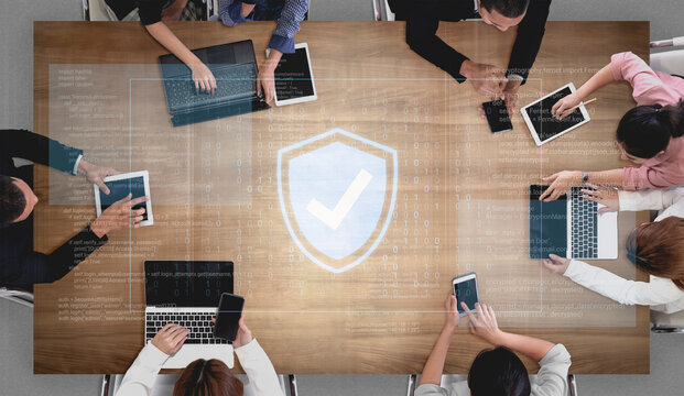 Collaborative Team Meeting with Digital Devices and Cybersecurity Concept, Diverse Group of Professionals Sharing Insights and Information. Glyphic.